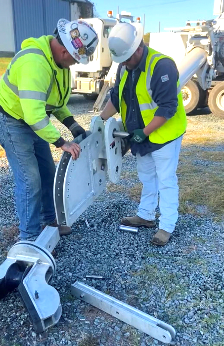 The Altec Batwing Portable Guard Structure attaches to Altec digger derricks or cranes and acts as a single-conductor guard. This T-6061 aluminum overhead safety mechanism ensures conductors stay off roadways and provides utility crews with a new, faster way to secure power lines when installing or maintaining them. 